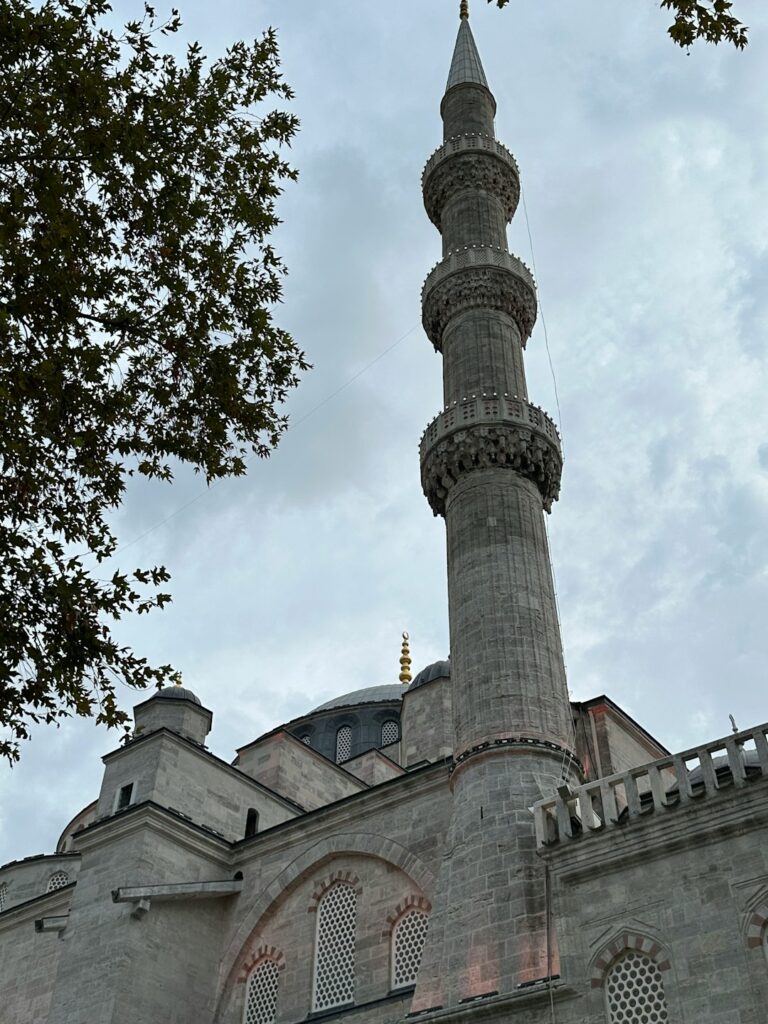 a tall building with a clock on the top of it