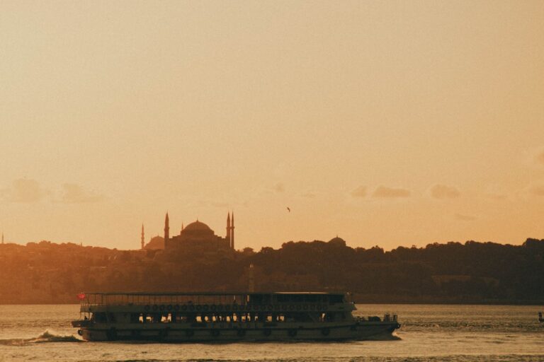 A large boat floating on top of a river