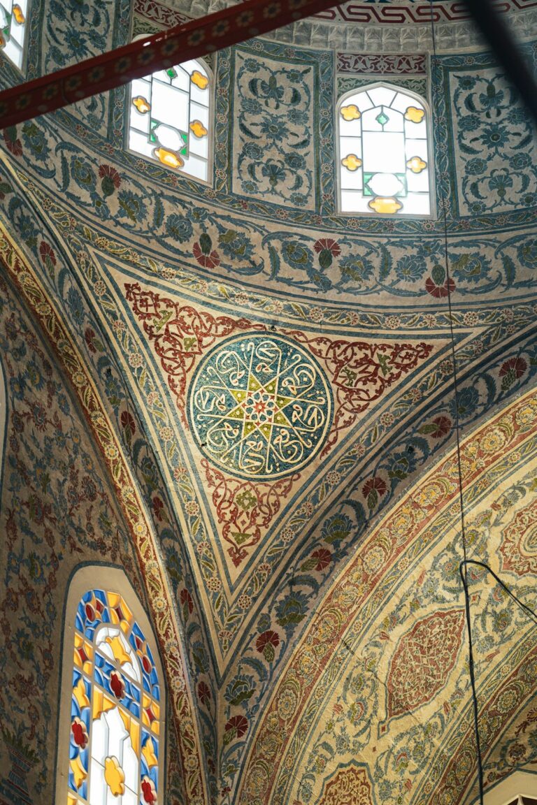 The ceiling of a building with stained glass windows